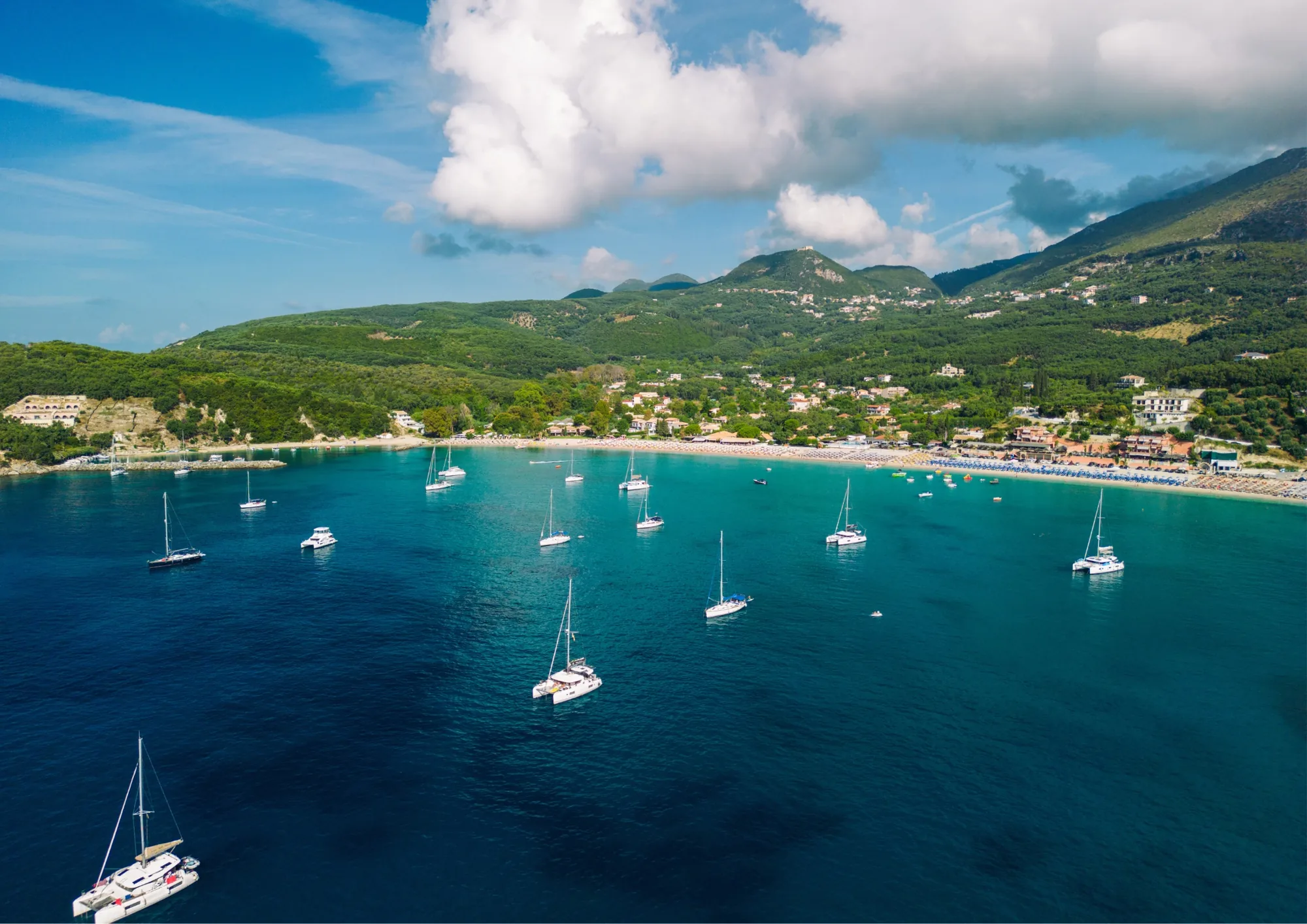 Sailing yachts anchored in a sheltered natural bay